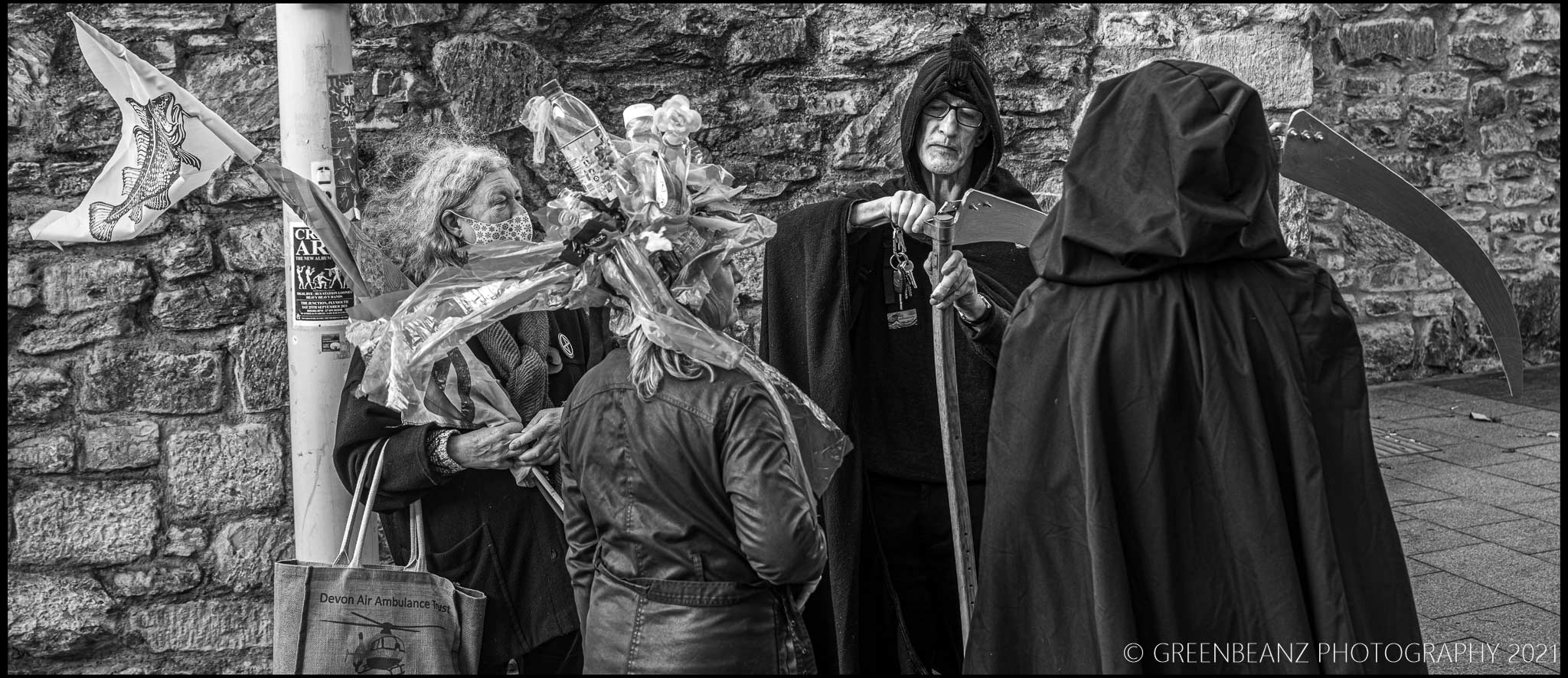 Death sharpens his blade with fellow protesters at Plymouth's Climate Awareness March in 2021