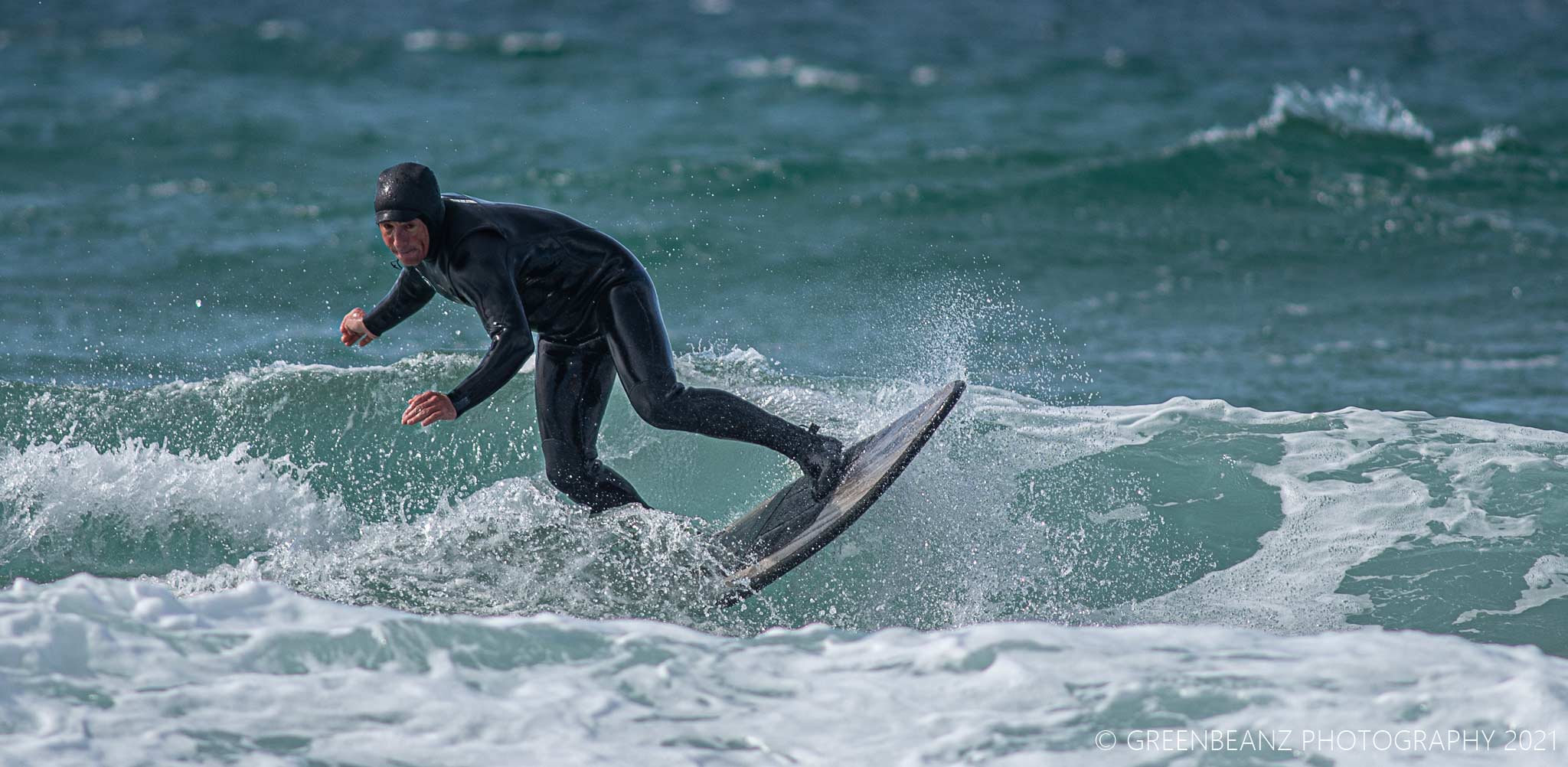Surfer at Fistral Beach in Cornwall 2021