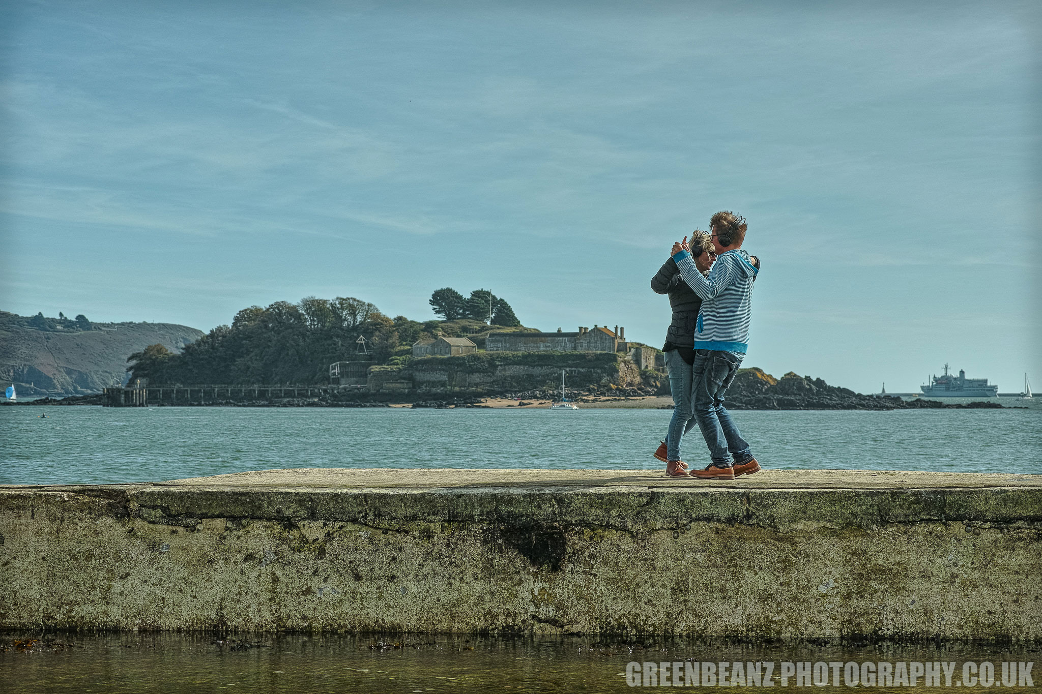 A couple dance to Ronald Binge's 'Sailing By' on the sea wall at Plymouth's Devil's Point Tidal Pool