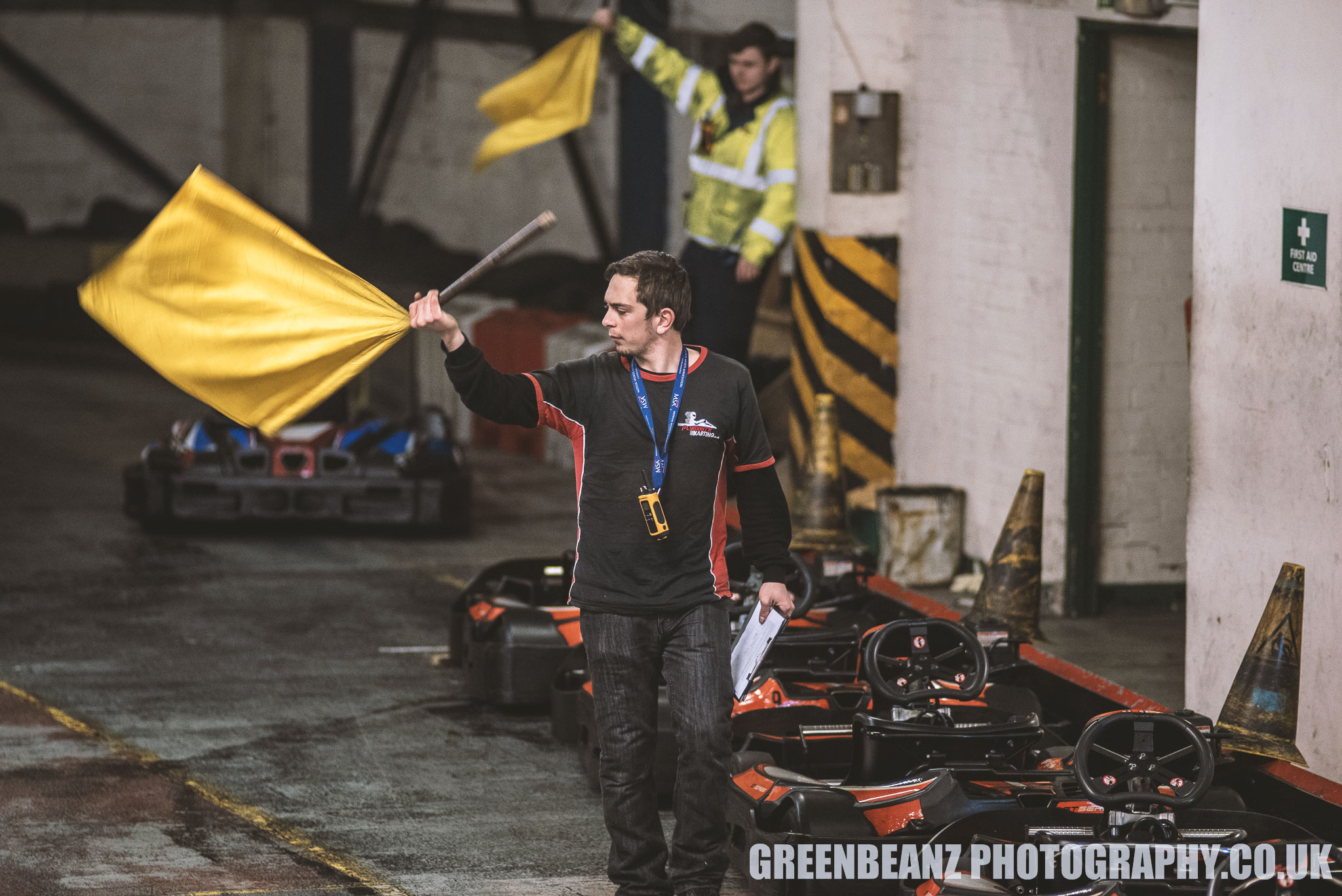Yellow flag being waved at Plymouth Karting Motorsport Event
