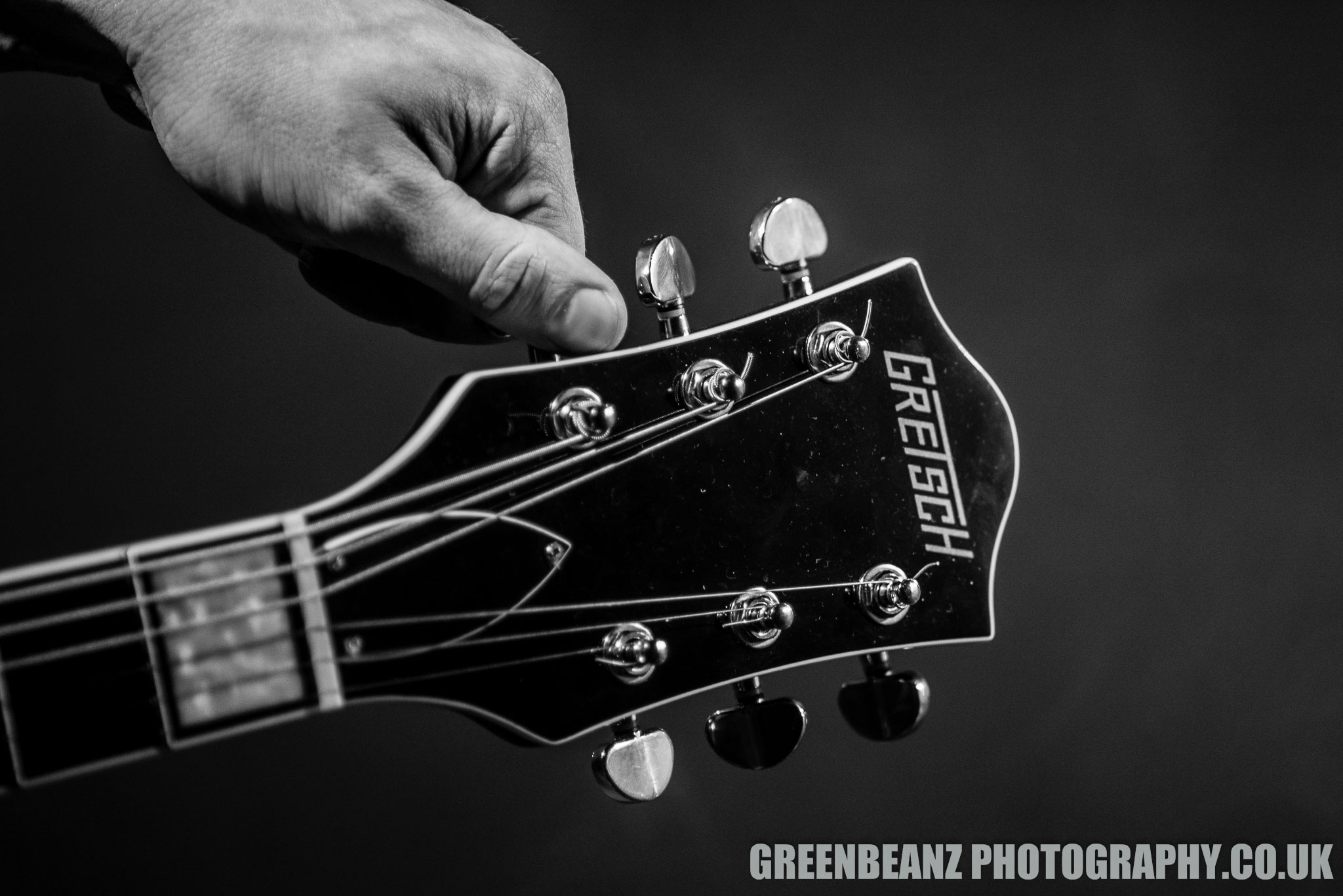 Chris Webb tunes his Gretsch Guitar at Underground Plymouth in 2018