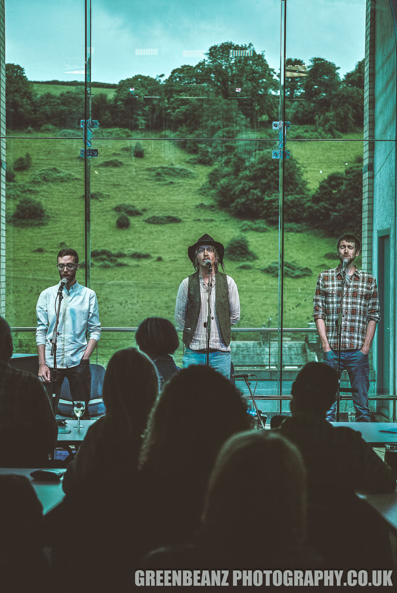 Windjammer sing acapella in front of the huge picture window in The Old Chapel Calstock a methodist chapel